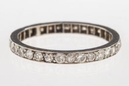 A full diamond eternity ring, set with a