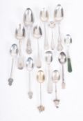 A group of silver spoons including; a sm