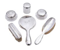 A matched silver dressing table comprisi