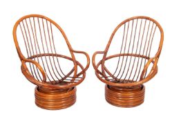 A pair of bentwood swivel elbow chairs,