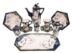 A Moorcroft pottery Cafe au Lait service, after the original by Emma Bossons,