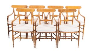 A set of seven Italian beechwood elbow chairs, by Ditta Levaggi & Son, in early 19th century taste,
