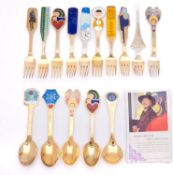 A collection of fifteen Danish silver gilt and enamel Christmas spoons by Anton Michelsen,