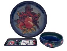 A Walter Moorcroft shallow bowl in the Pansies pattern, impressed marks and facsimile signature,