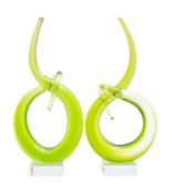 A pair of green 'Curl' sculptures, set on clear square bases, circa 1970, 29cm high,