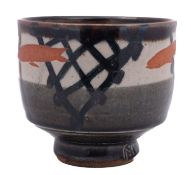*John Maltby [1936-2020] a stoneware yunomi, the exterior stencilled with fish on a cream,