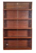 A Simplex mahogany and glazed five section graduated sectional bookcase, 205cm high, 35cm deep,