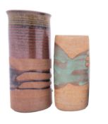 *Peter Lane [b 1932] two stoneware vases, one of cylinder form under banded brown and green glazes,
