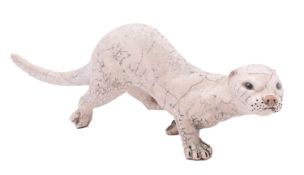 Dillon Rudge [Contemporary] a raku fired Otter in dynamic pose, incised DR and 77, 41cm long.