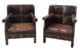 A pair of studded leather wing armchairs in Aesthetic Movement style,