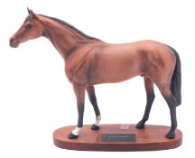 A Beswick Connoisseur Series Racehorse, set on wooden base. [glue repair to ear].