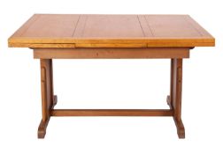 An oak dining suite of draw-leaf table and six chairs, in Art Deco style,
