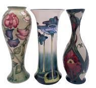 Three Moorcoft pottery vases, comprising Sweet Pea modelled after the original by Sally Tuffin,