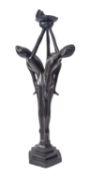 A patinated metal figural table lamp,