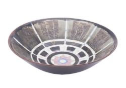 *Terri Holman [Contemporary] a white stoneware bowl the centre with pink and gold star motif within