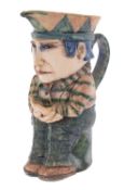 *Amanda Popham [b 1954] a stoneware jug modelled in the form of a seated man with pensive