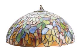 A leaded glass ceiling lamp in the manner of work by Tiffany, later 20th century; of domed form,