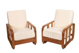 A pair of oak lounge chairs, almost certainly by Heal & Co.