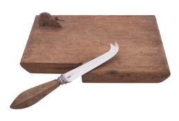Probably Ben Oxley 'Mouseman' of Windsor, a carved oak cheeseboard,