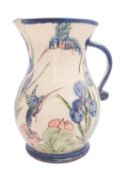 Paul Jackson [Contemporary] a large terracotta jug of bellied form with ribbed strap handle with