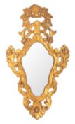 A carved and giltwood framed wall mirror