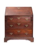 An early 19th Century oak bureau, the sl