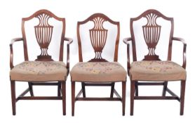 A set of three George III mahogany dinin