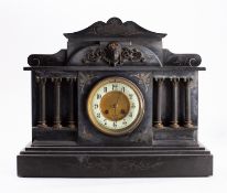 A late 19th century black slate mantel c
