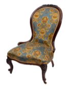 A Victorian carved walnut and upholstere