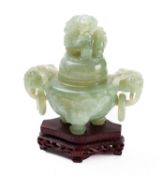 A Chinese carved green hardstone tripod