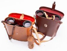 Two pairs of binoculars and a lens. Comp