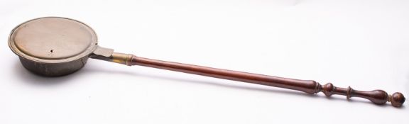 A 19th century brass warming pan with tu