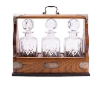 An Elizabeth II three bottle tantalus by