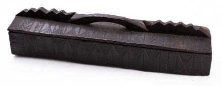 A carved and stained wood box, possibly