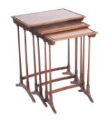A nest of three mahogany occasional tabl