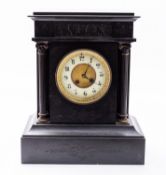A black slate mantel clock having an eig