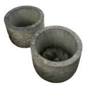 A pair of stone composition planters in