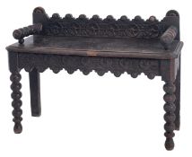 A Victorian carved oak hall bench, late