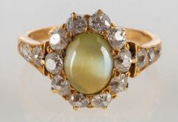 A fine Edwardian cat's eye chrysoberyl and diamond ring