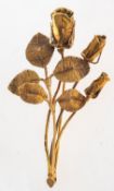 A flower spray brooch, of roses, marked 585 to the front and the pin and other Foreign marks,