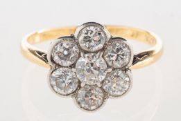 A diamond daisy ring, set with seven old brilliant-cut diamonds, diamonds approx. 0.