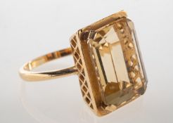A 9ct gold citrine cocktail ring, claw set with a rectangular-cut citrine, citrine approx. 13.