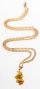 A gold nugget pendant with curb chain, a rough gold nugget with pendant bale, unmarked,