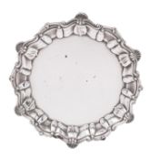 A Victorian silver waiter by James Charles Jay, London 1898, of shaped circular form,