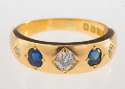 A Victorian 18ct gold diamond and sapphire ring, set with three old-cut diamonds,