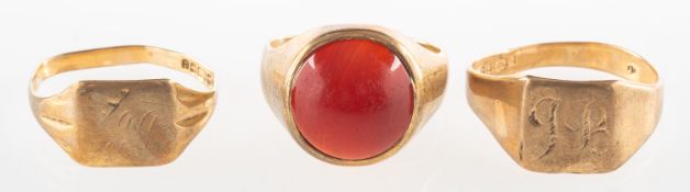 A group of three 9ct gold signet rings, including two rectangular signet rings,