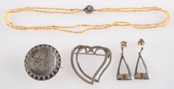 A small group of jewellery, including a Victorian brooch with swallow and foliate etching