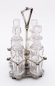 An early 20th century silver plated four bottle cruet by Hukin & Heath, London, model number 1290,