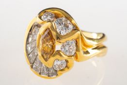 A handmade fancy yellow diamond and white diamond ring, of abstract design,