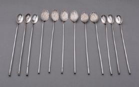 Two sets of six Indian Export silver spoon straws, marked on the stem, six with shell bowls,